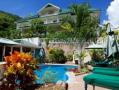 View of the new apartment hotel Hanneman Holiday Residence from the pool and gazebo area.